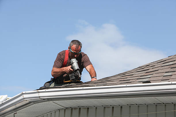 Man working on a house roof.